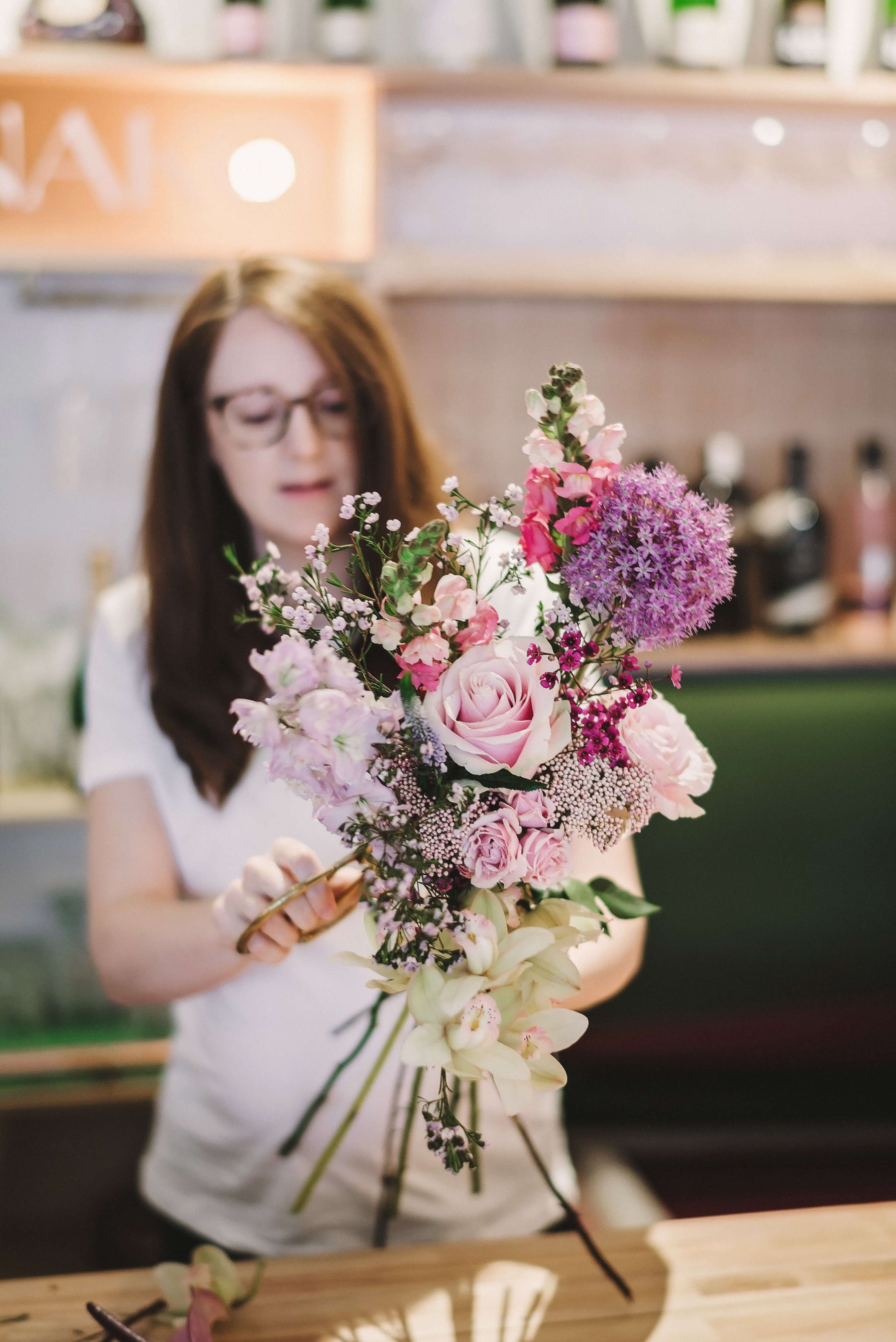 Florist Working In Her Flower Shop. by Stocksy Contributor Mosuno -  Stocksy
